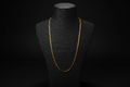 Cadena tejido cubano italiana en oro 18k en busto negro